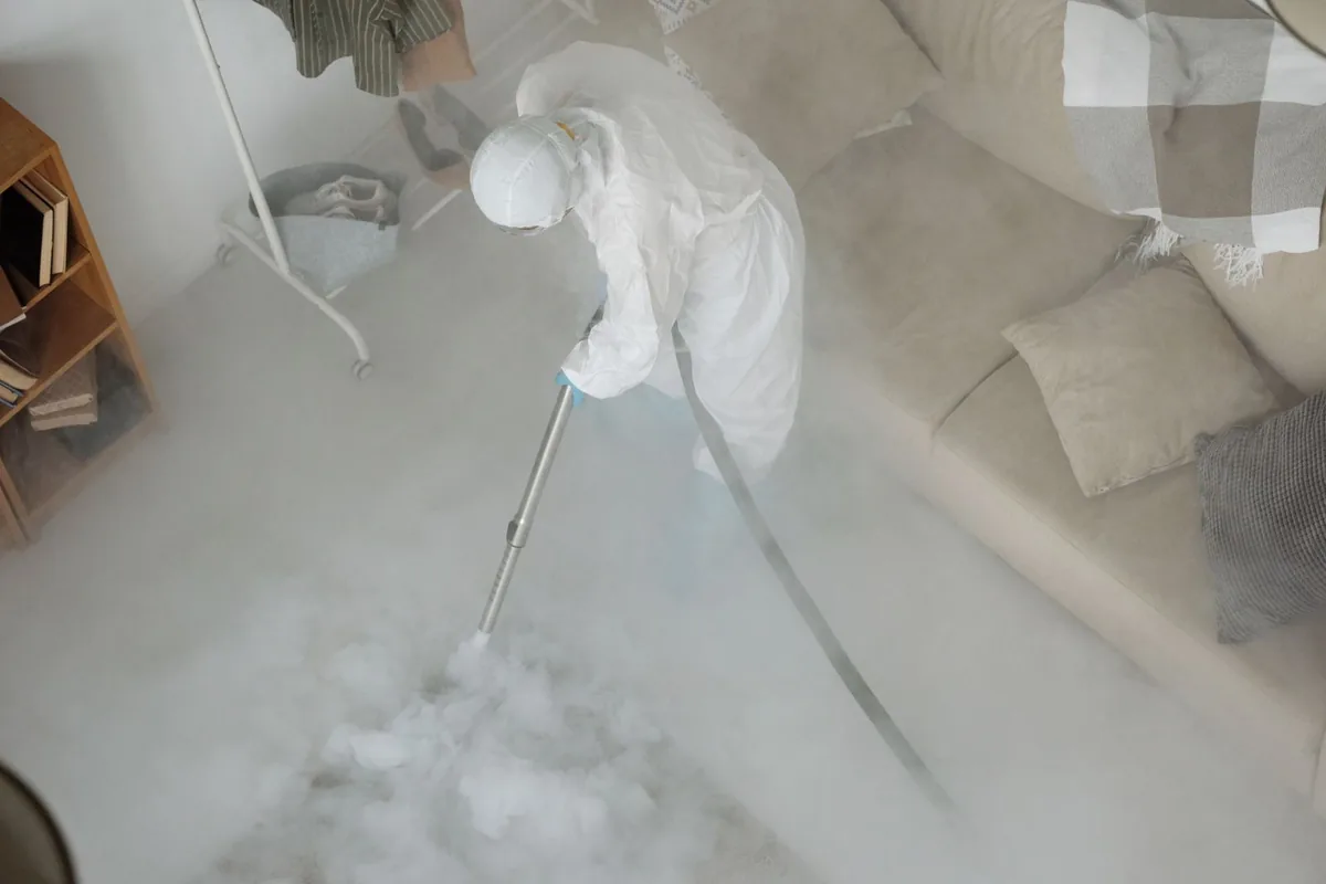 Biohazard cleanup technician in protective equipment, Arlington, MN